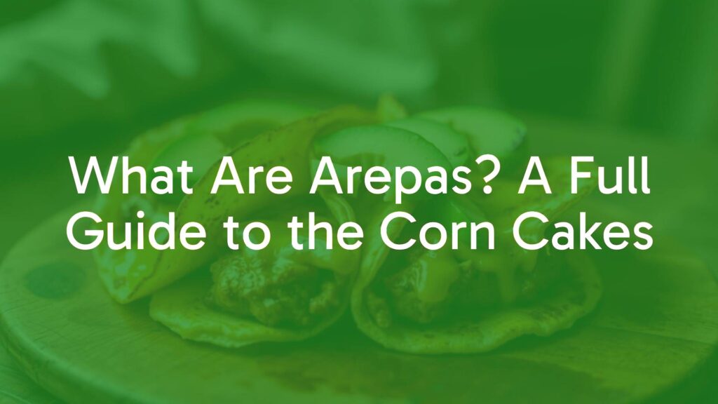 Golden brown arepas on a rustic wooden table, topped with melted cheese and avocado slices, soft interior with crispy crust, traditional South American corn cakes, warm and inviting lighting, realistic food photography.