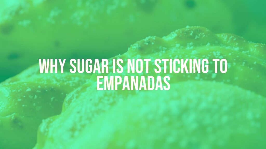Freshly baked empanadas with golden crust, sugar sprinkled on top, close-up, warm lighting, realistic.