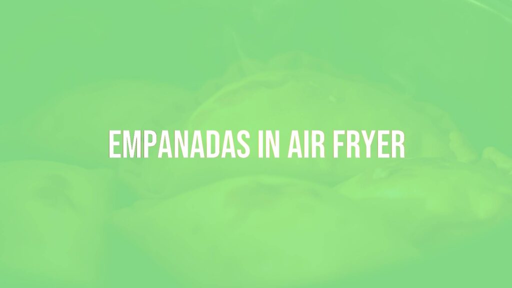 Golden crispy empanadas cooking in an air fryer, steam rising, close-up shot, warm lighting, realistic.